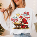 Santa Kneeling at the Manger