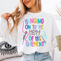 Hanging On To the Hem of His Garment